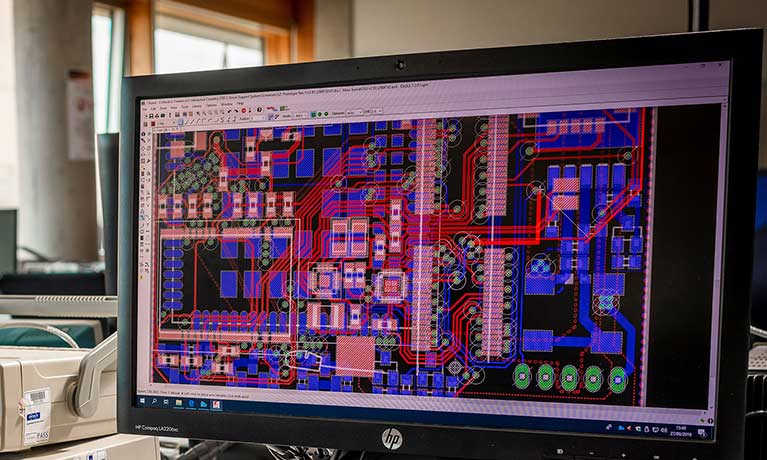 Close up of a computer screen displaying a multi coloured graphic