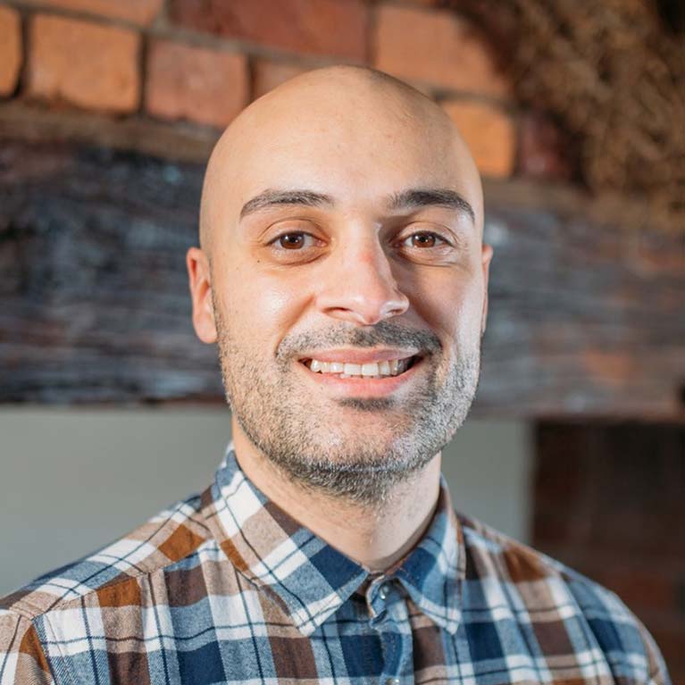 Headshot of Dylan Cozens smiling at the camera.