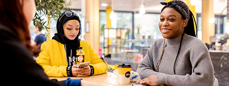Students talking around a table