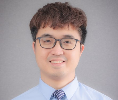 Tu headshot portrait wearing a shirt and tie