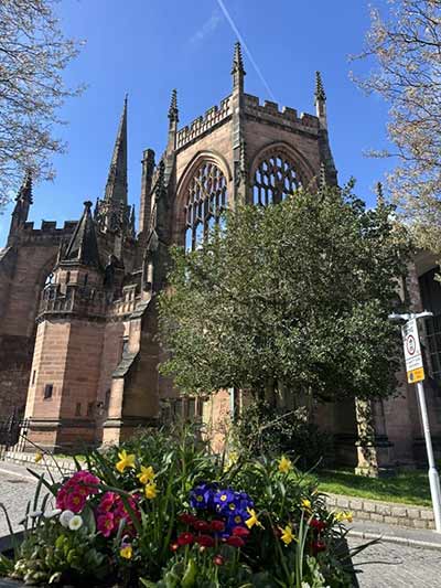Coventry Cathedral building with a sunny blue sky