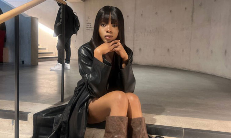 Laura Onome Momodu posing in a stairwell 