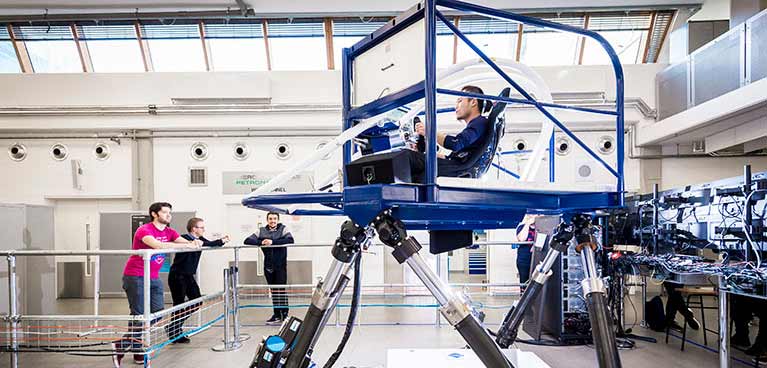 Formula one simulator being used by young students