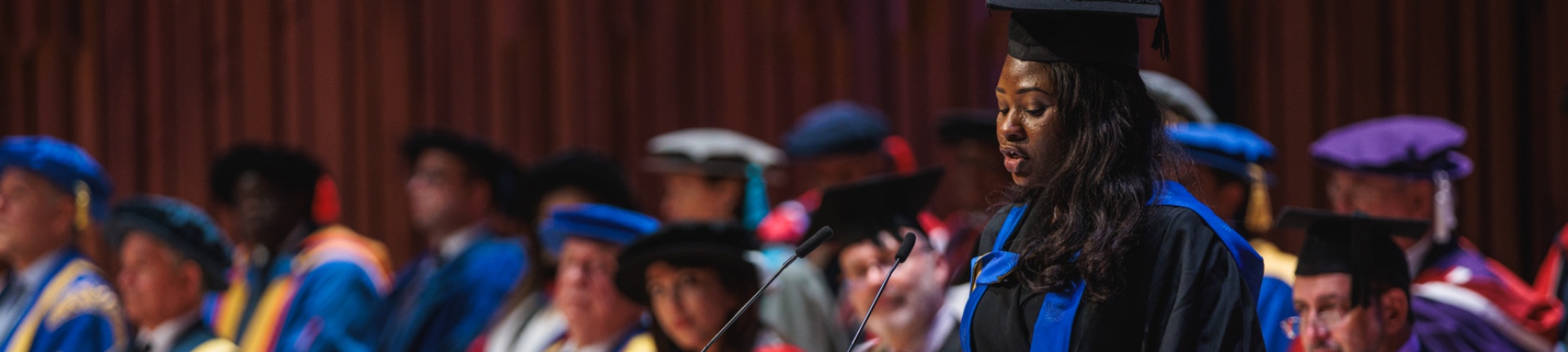 Graduate giving a speech at a ceremony