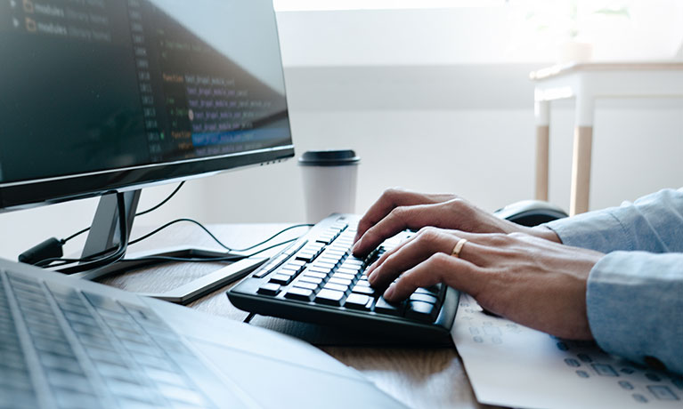 Someone typing on a keyboard