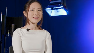 Daisy choi sitting in a studio