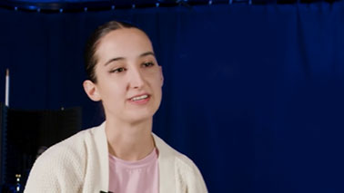 Leila grebby sitting in a film studio