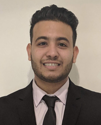 Close up portrait of Rahul Mehrotra with a plain background