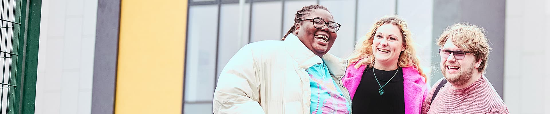 Three students stood next to each other