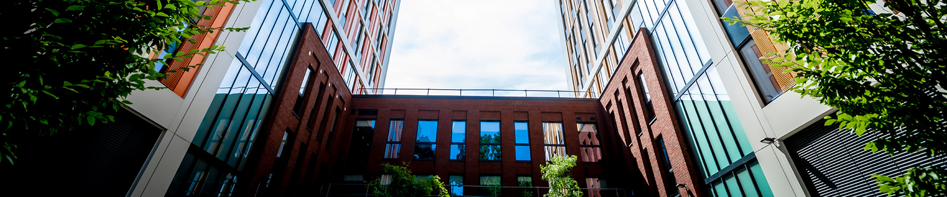Looking up towards bishopgate accommodation, with yellow and orange cladding