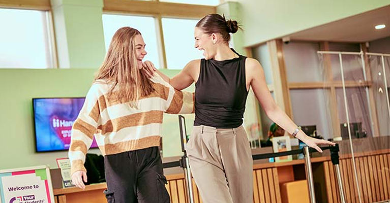 Students walking and laughing together