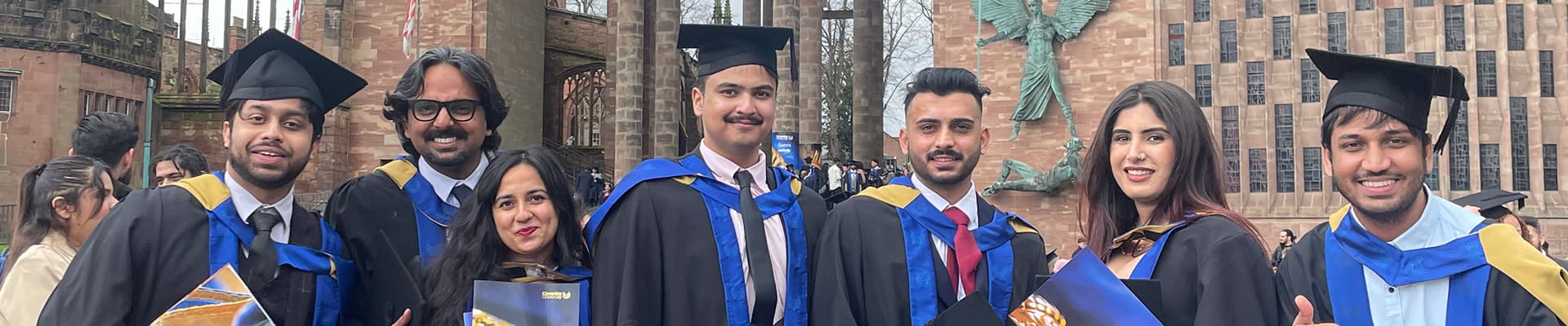 Group of graduation students celebrating together in university square