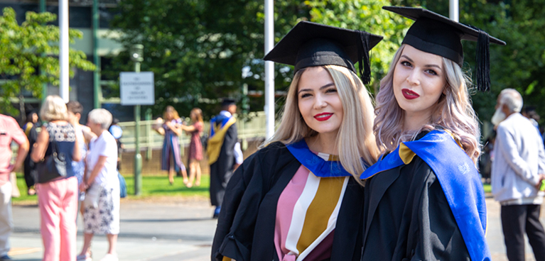 Students outside after the graduation ceremony