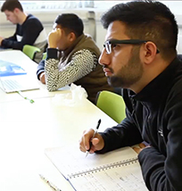 Students sitting at a desk 