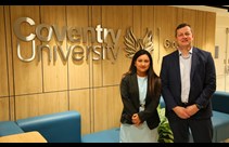 Regional Managing Director for the India Hub, Leena Arora Kukreja, and Deputy Vice-Chancellor (International), Richard Wells, stood infront of a wall-mounted Coventry University logo inside the India Hub