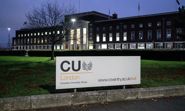 The CU London campus building and sign in the dusk evening light