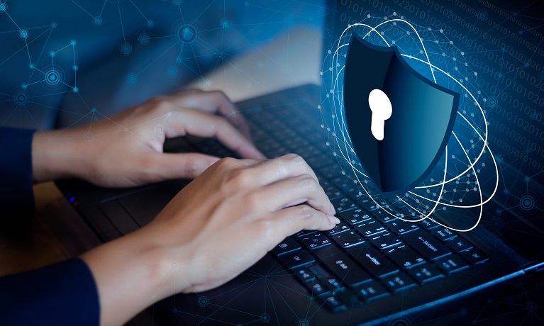 Hands typing on a computer keyboard with a CGI of a padlock hovering over the computer