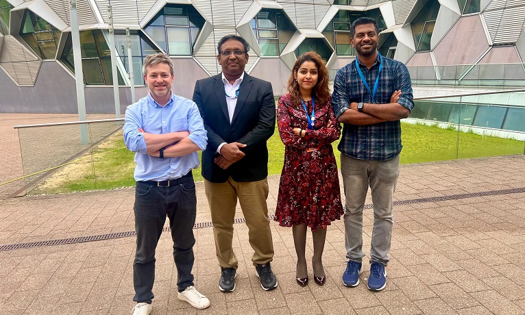 Coventry University's project team stood in a row outside the engineering building smiling at the camera