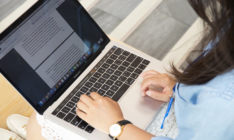 A student using a laptop computer