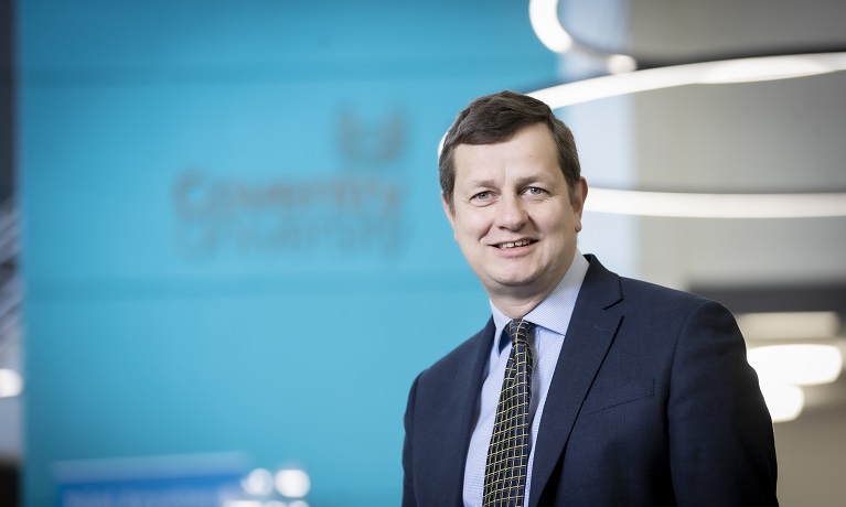 Coventry University's Pro-Vice-Chancellor (International) Richard Wells wearing a suit and tie