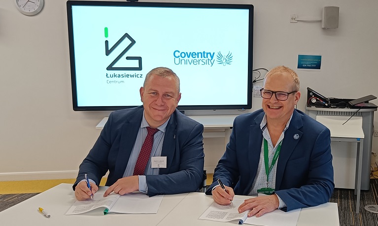 Professor Rafal Lukasik, from the Lukasiewicz Research Network, and Professor Richard Dashwood, from Coventry University Group, signing the Memorandum of Understanding