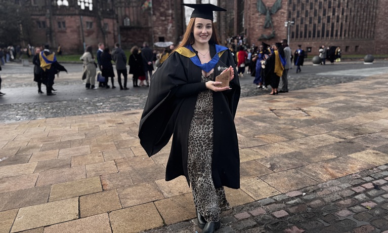Erin Graham pictured with her award at graduation