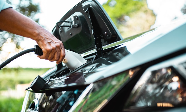 An electric vehicle being charged