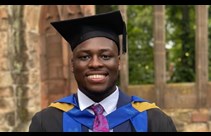 A picture of a student in their graduation robes