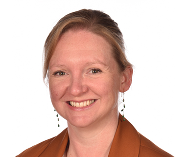 Headshot of Tracey Marshall against a white background.
