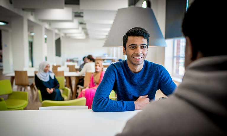 smiling student in an open area