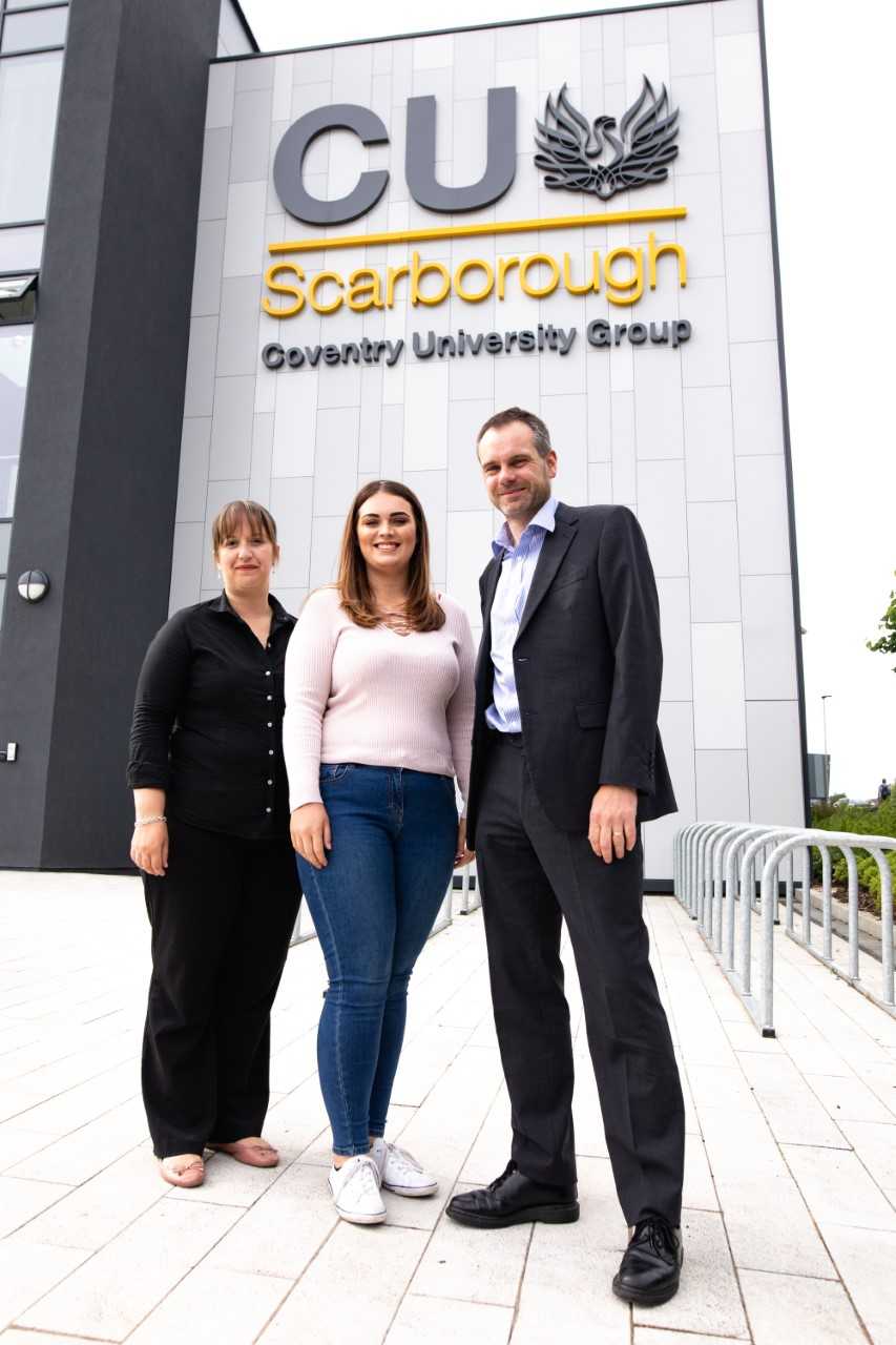 Three people stood outside CU Scarborough