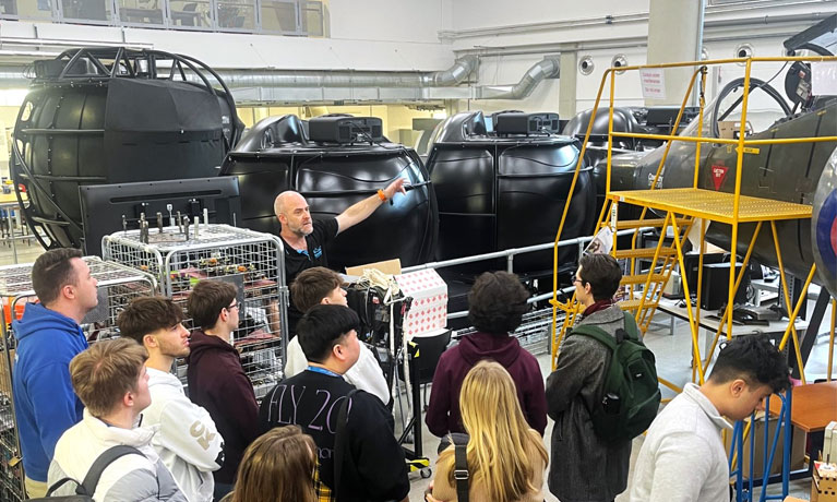 Students viewing the harrier jet and other aviation facilities at Coventry University on a field trip to the UK.