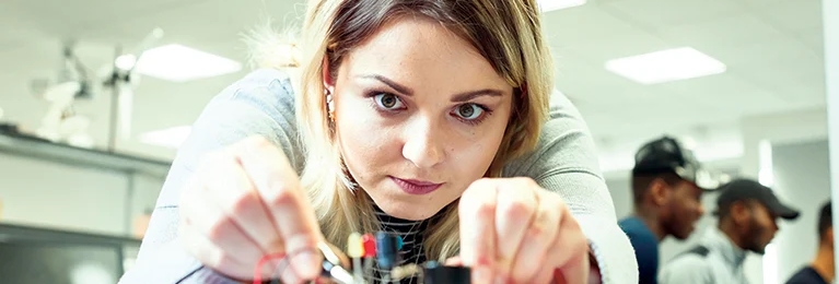 A student concentrating on her work