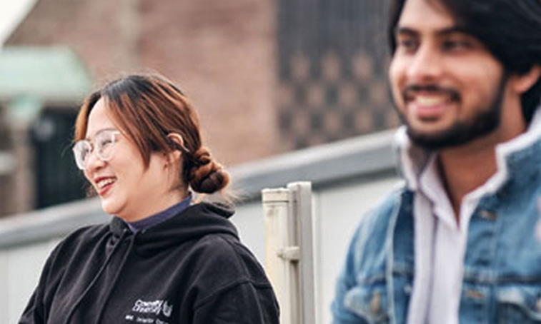 Students talking together outside the coventry cathedral